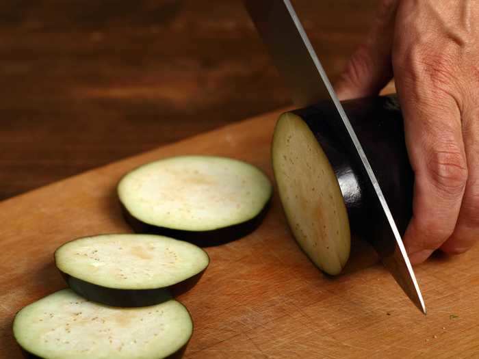 Using a dull knife to cut eggplant can cause oxidation, turning the slices brown.