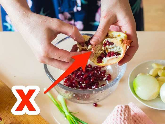 Retrieve pomegranate seeds with less mess by slicing the fruit in half first.