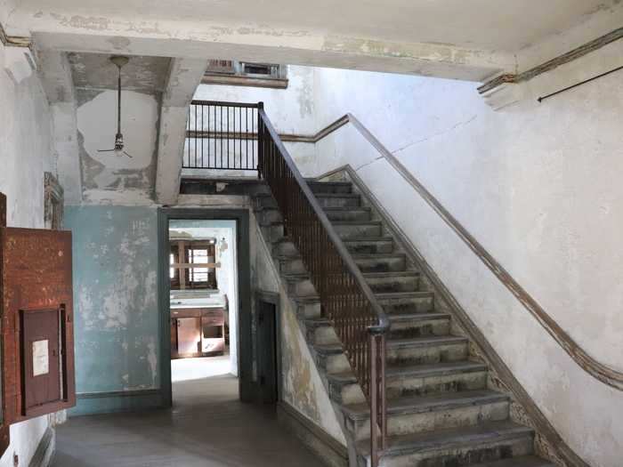 Upon entering the home, I was immediately greeted by a grand staircase that led to the second floor.