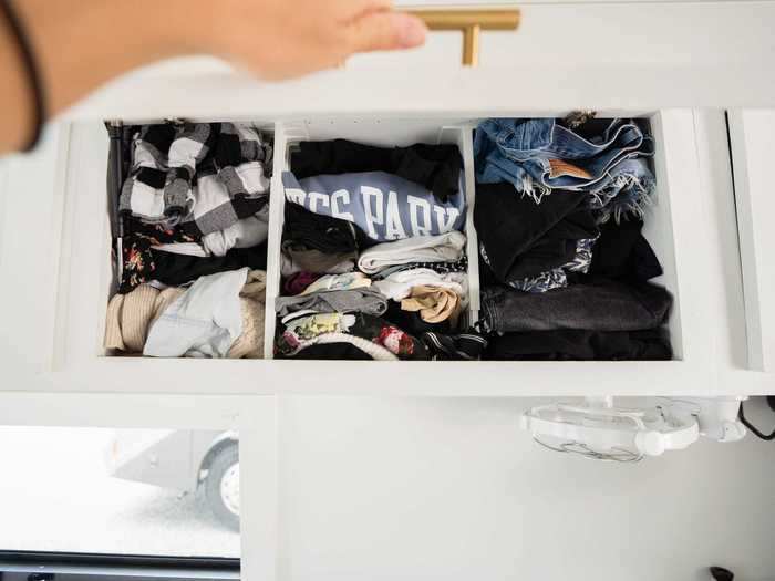 Instead of a closet, Kara and Nate keep their clothes in cabinets and drawers.