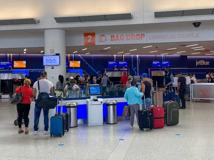 Passengers appeared to be respectful of distancing in the terminal though in some areas, like the bag drop, lines formed that made staying six feet apart slightly more difficult.