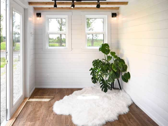 These three rooms, combined with a sleeper couch in the living room, allow the tiny home to sleep up to eight people.