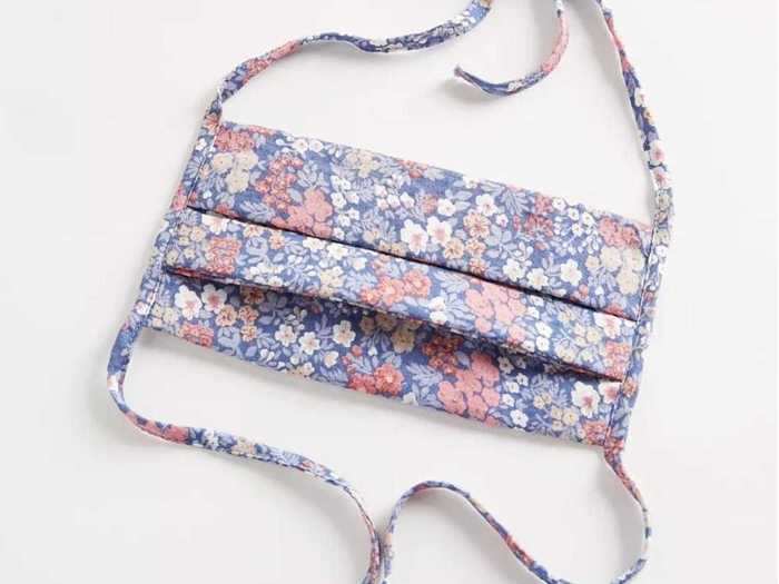 Urban Outfitters is selling a $12 face mask with a pastel-colored dainty floral design.