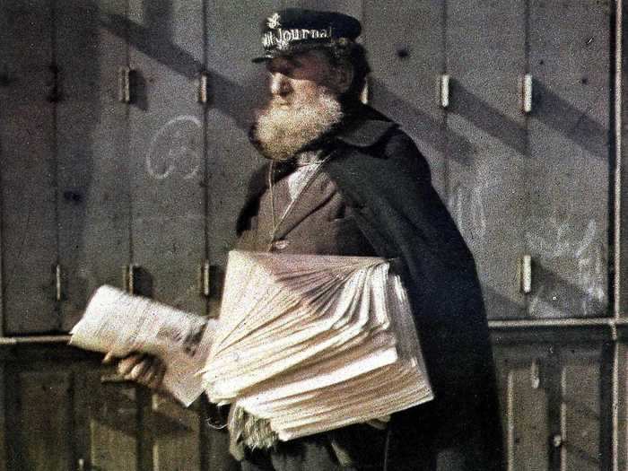 A newspaper seller was photographed on the streets of Reims, France, in 1917.