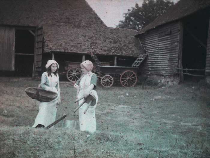 Two farm workers were photographed sometime between 1910 and 1915.