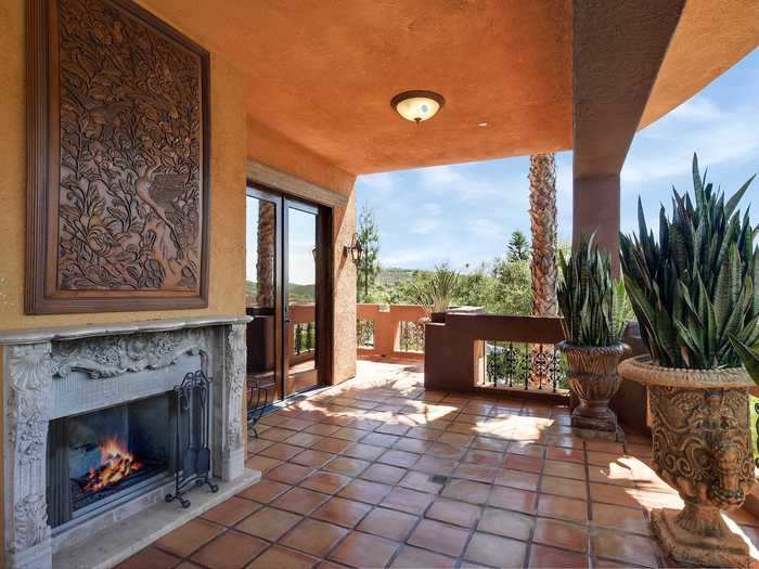 The two upstairs bedrooms enjoy private balconies with fireplaces.