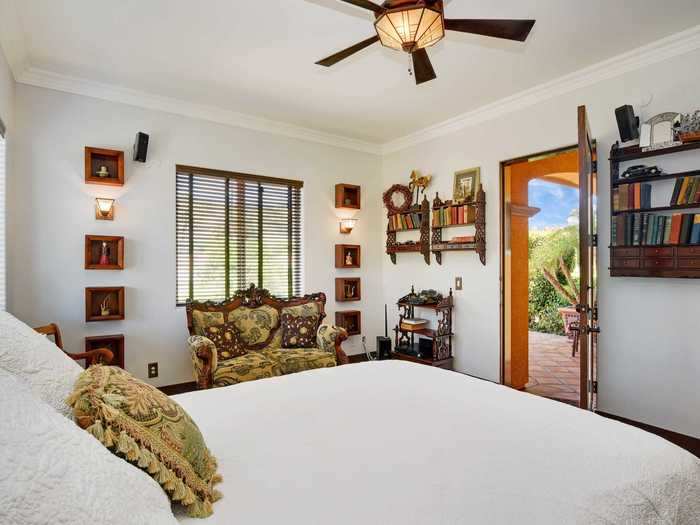 The main floor includes four guest bedrooms, each with its own private bathroom and doors that open up to the outside.