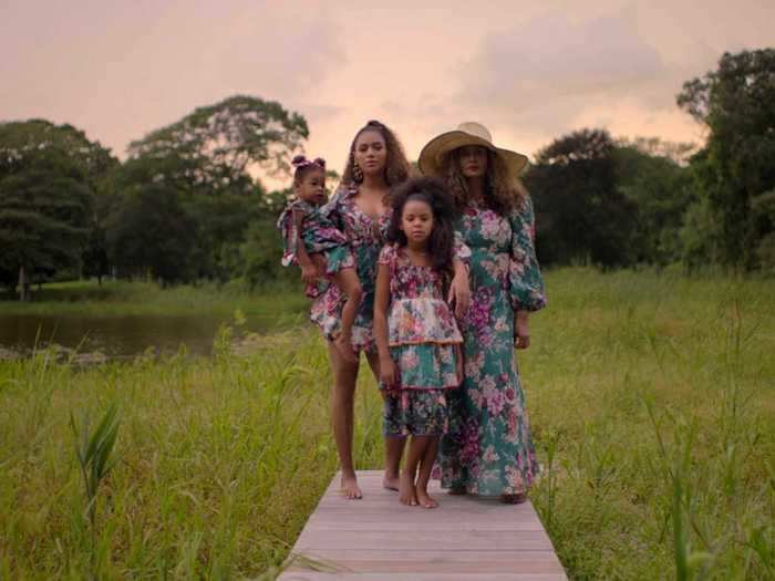 Three generations of Knowles women stand together.