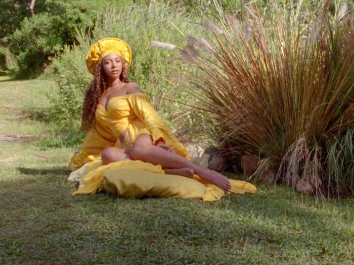 In this drapey yellow ensemble, Beyoncé evokes the Yoruba deity Osun.