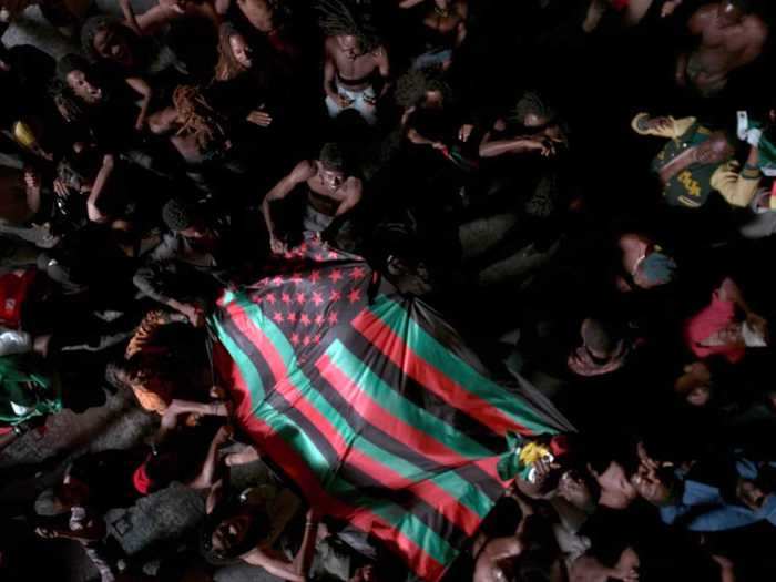 The next scene features the African-American Flag, created by David Hammons.