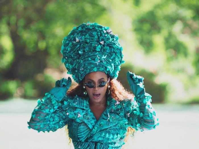 Beyoncé continues the blue-green color symbolism with a Nigerian-inspired look by 5:31 Jérôme.