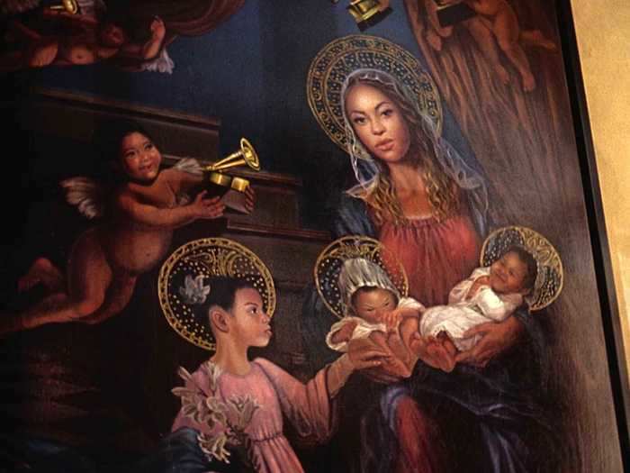 Another painting of Beyoncé as a saint-like maternal figure, this time accompanied by her three children, hangs in the mansion.