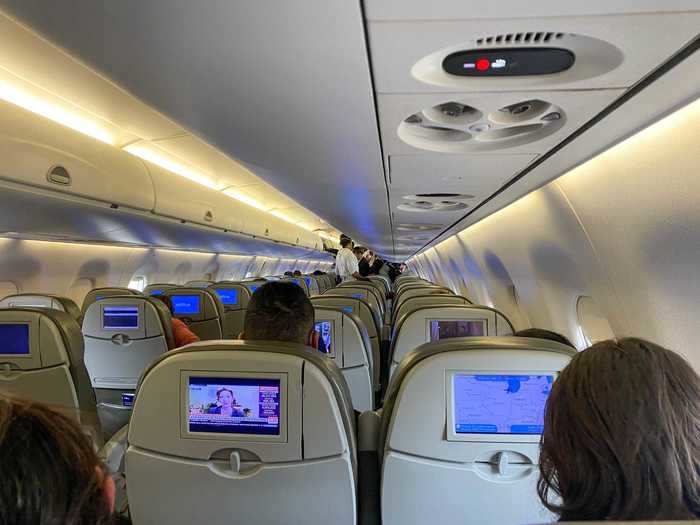 Flight attendants asked passengers to stay seated during deplaning until it was time for their row to go and most complied.