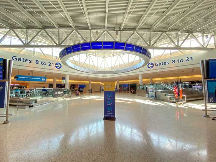 Despite the chaos, the actual screening process took only a few minutes – with agents letting TSA PreCheck members keep their shoes, belts, jackets, etc. on – and I arrived at the Terminal 5 atrium.