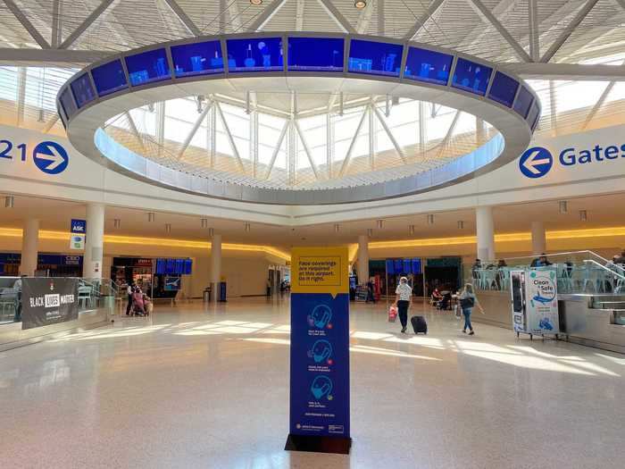 A single piece of social distancing signage from the Port Authority had replaced the thousands of passengers that normally traverse the atrium en route to their gate.