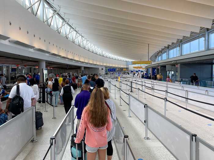 And airport staff strictly enforced the six feet rule, though neither placards nor staff were ensuring distancing in the part of the line that had backed up into the check-in area.