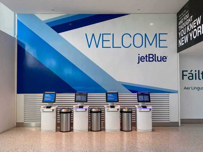 The lonely walk to the terminal ended at the old familiar welcome sign from all the airlines that use Terminal 5, with JetBlue