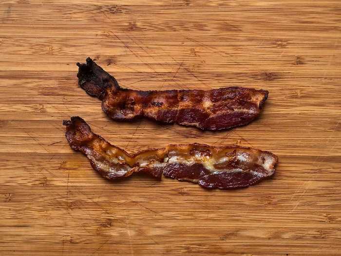 Using a broiler and parchment paper resulted in shrunken bacon strips that cooked unevenly.