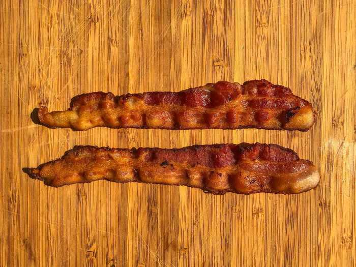 Starting the bacon in a cold, dry skillet left me with evenly cooked strips.