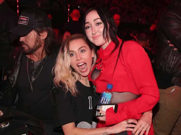 Miley Cyrus is sandwiched between five siblings.