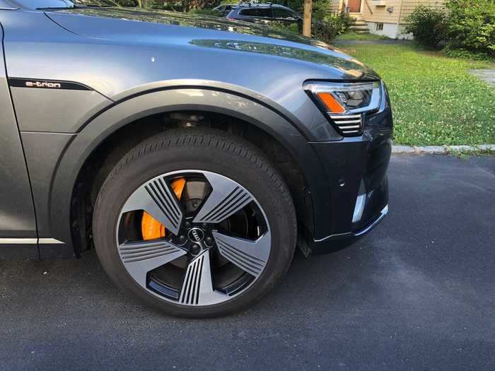 A distinguishing feature for the e-tron — one of its few electric tells — are the 21-inch, five-spoke wheels, with orange brake calipers.