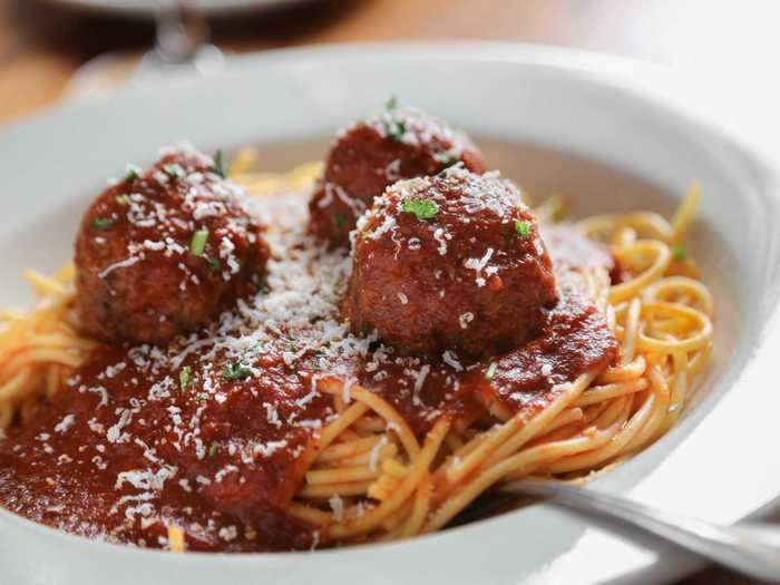 Spaghetti and meatballs is an Italian-American delicacy.