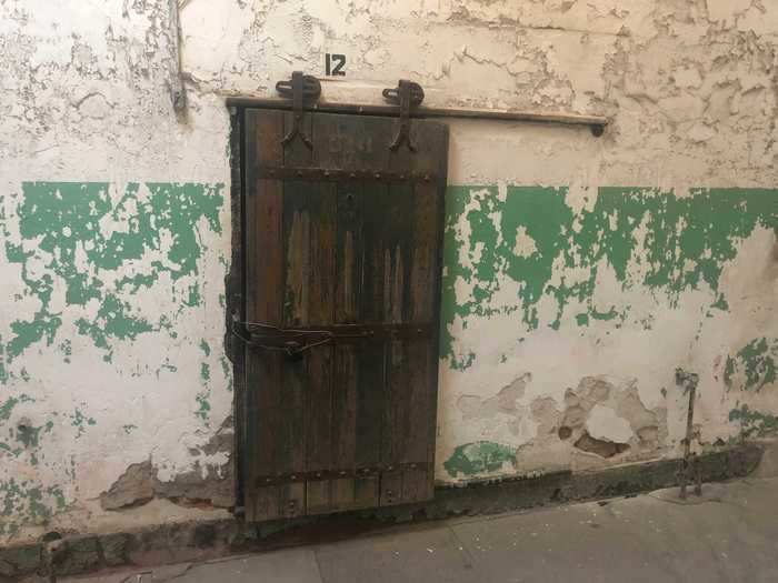 The doors seen in the cell block today were actually installed much later. When the prison first opened, these doors were actually just small openings to pass food through so the inmate could live in solitude.