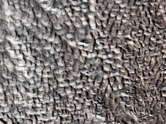 Known as brain terrain, this kind of pockmarked land on Mars remains a scientific mystery.