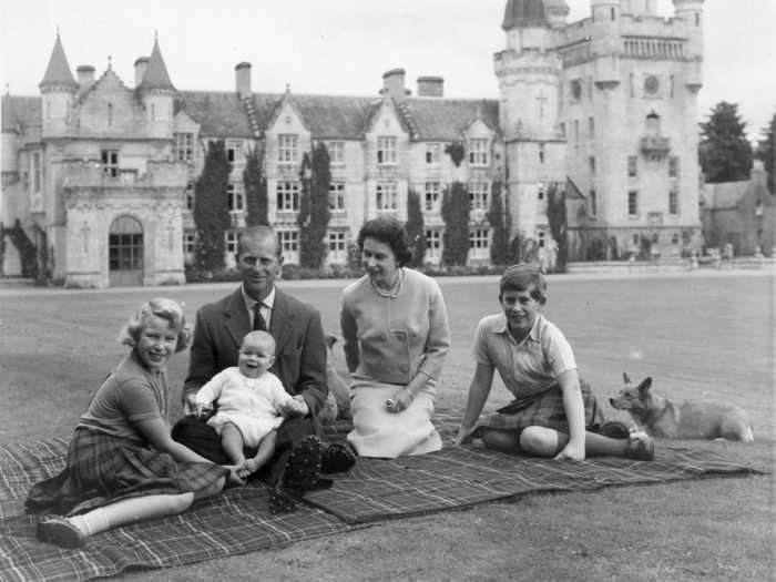 Queen Elizabeth, the Duke of Edinburgh, and their children have spent plenty of time vacationing at Balmoral, one of the only properties owned by the family and not the Crown. Here they are preparing for a picnic in front of the castle during the summer of 1960.