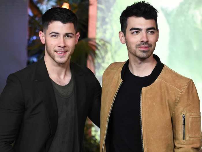 Nick and Joe have matching arrow tattoos on their arms.