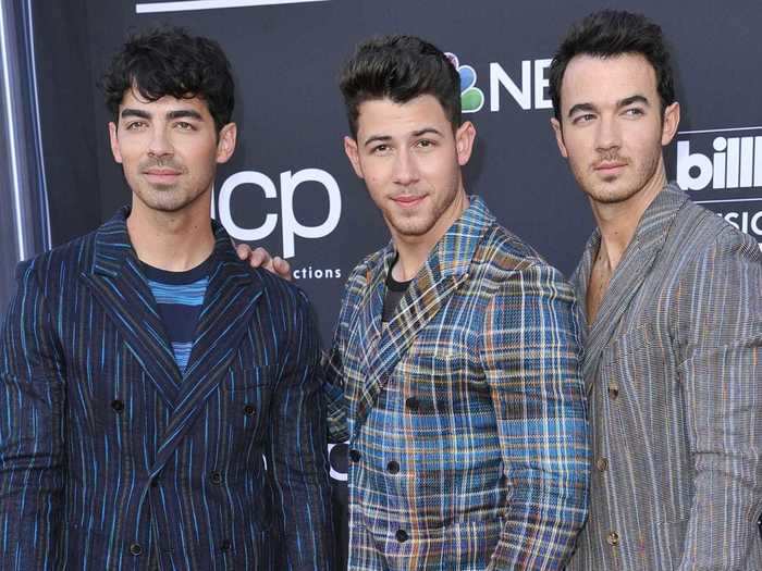 At the Billboard Music Awards in May, the band coordinated their striped outfits.