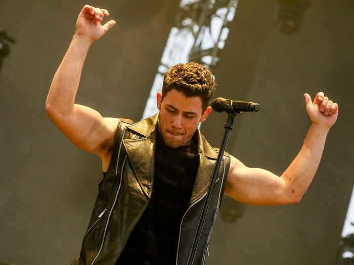 Following the success of solo tracks "Chains" and "Jealous," Nick showed off his biceps while performing in California in May 2015.