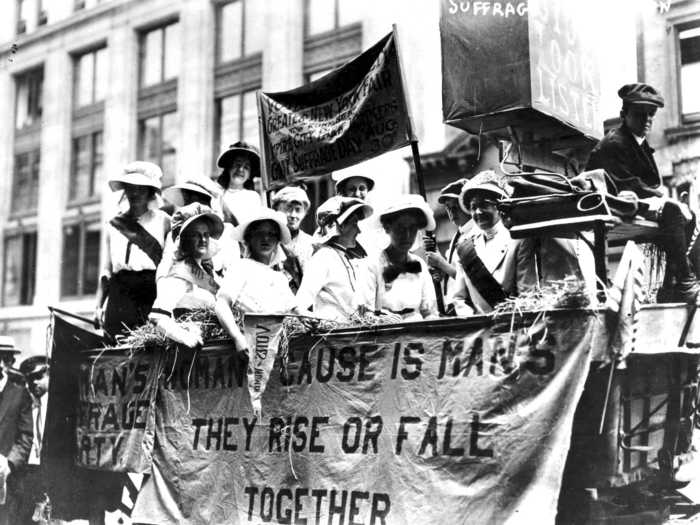 Another 1913 banner quoted poet Lord Alfred Tennyson: "The woman