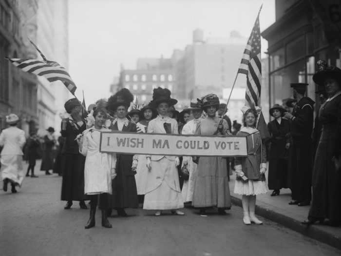 Demonstrators carried signs with slogans like "I wish Ma could vote."