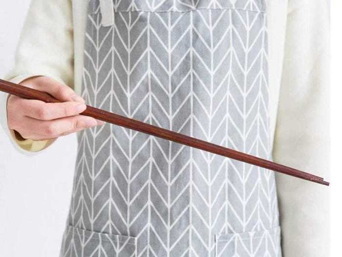 A pair of long wooden chopsticks