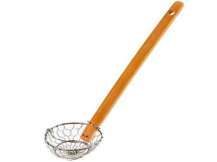 A small strainer with an extra long handle