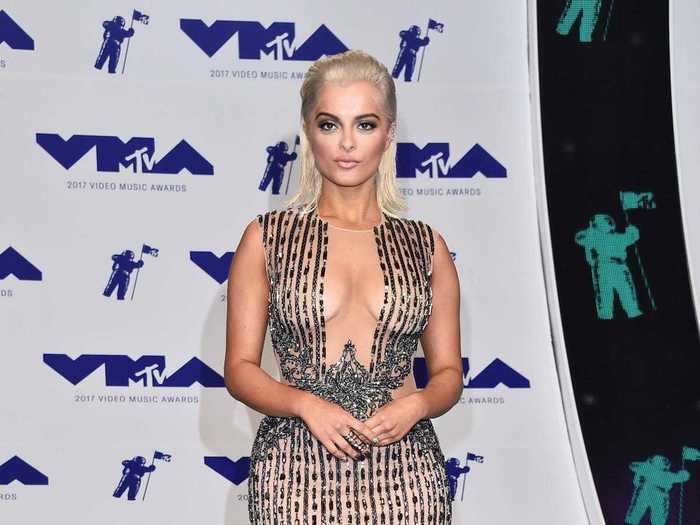 Bebe Rexha wore a floor-length sheer gown with an illusion neckline and a silver, chain-like pattern to the 2017 MTV VMAs.