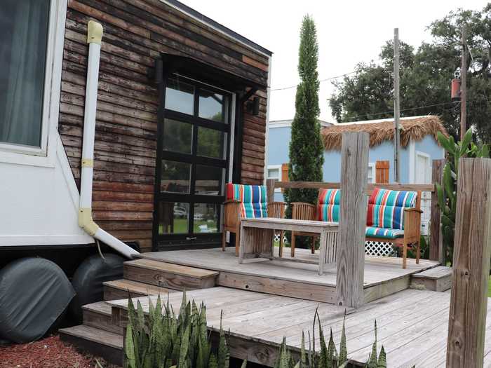 The garage door opened onto a spacious deck, which had perfect views of the lake.