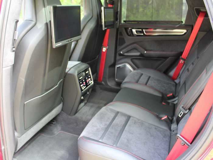 The rear seats are luxurious, and legroom is decent. My Porsche Cayenne GTS tester was fully outfitted for rear-seat entertainment, an offbeat option for what