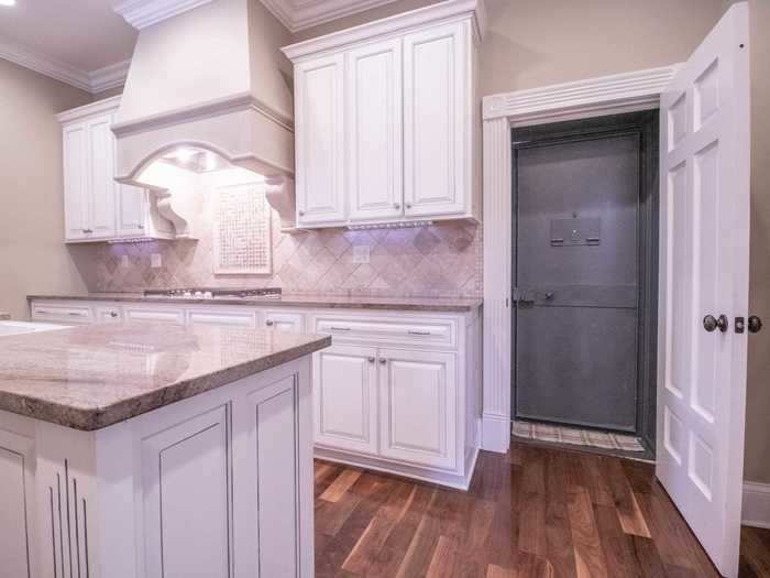 The kitchen also has a less common and sought-after feature: an entrance to the home