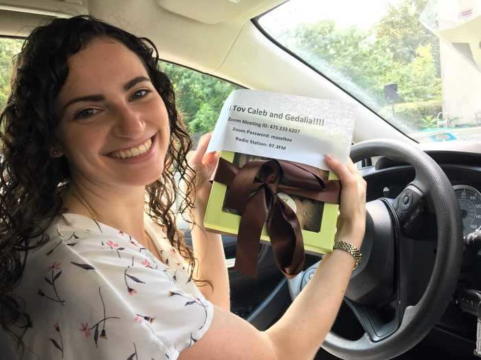 A wedding coordinator came around to all the cars with a slip of paper detailing the Zoom and radio frequency information.