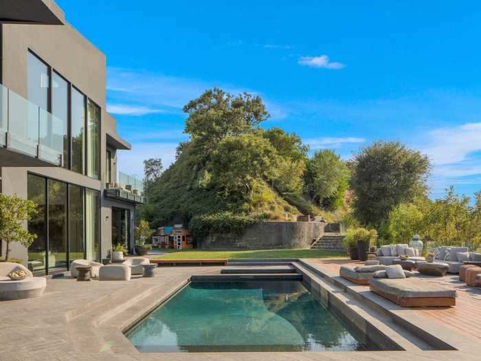 And of course, any respectable Los Angeles mansion must have a pool: Teigen and Legend