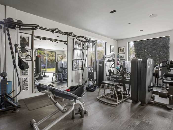 The house has its own home gym with a variety of exercise equipment.