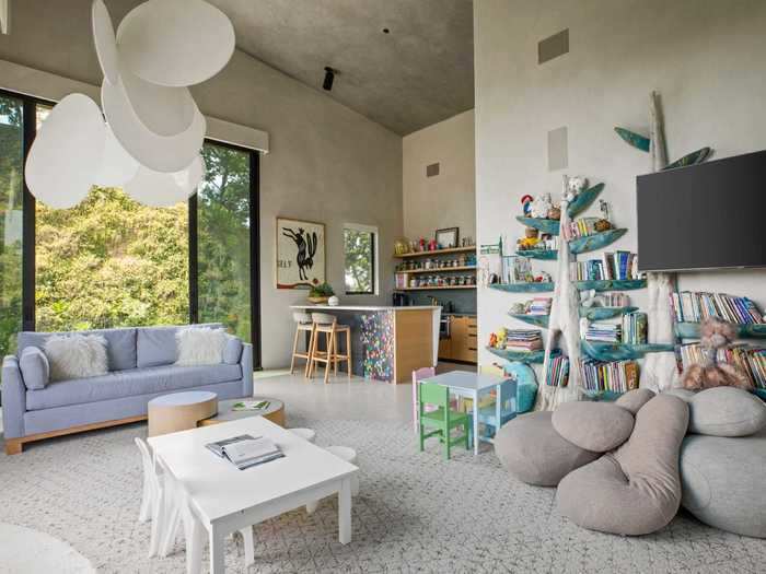 Listing photos show a spacious playroom where Teigen and Legend