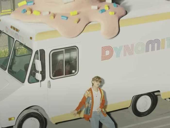 The ice cream truck V dances in front of is also supposedly under the "Dynamite" franchise too.