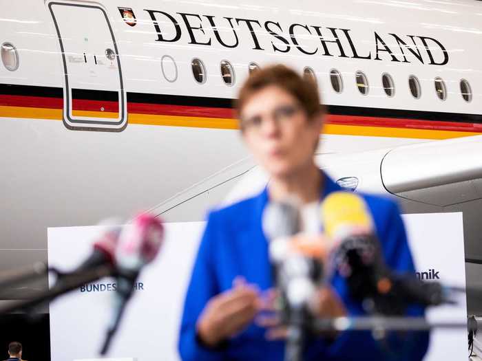 The official name of the country "Bundesrepublik Deutschland," or Federal Republic of Germany in English, sits in all capital letters over the windows on both sides of the aircraft.