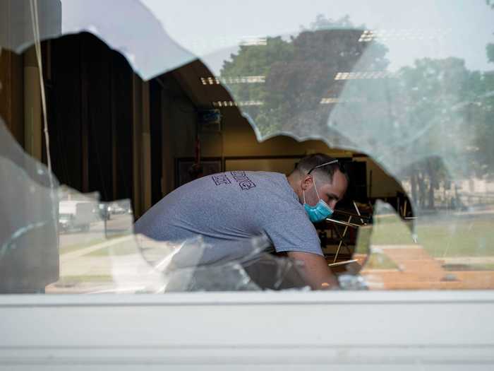 Volunteers, residents, and business owners gathered to clean up the damage from the protest on Sunday night.