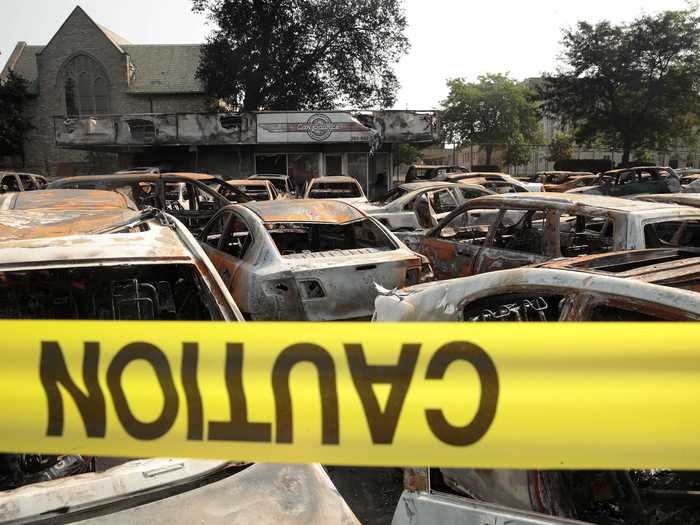 The aftermath of the protest revealed burned cars, trucks, and businesses.