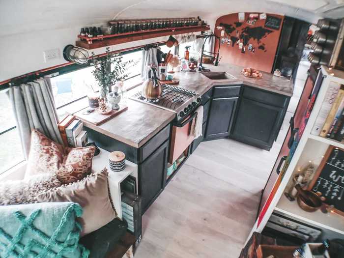 The L-shaped kitchen has a built-in eating nook that doubles as a space for the kids to do their schoolwork.