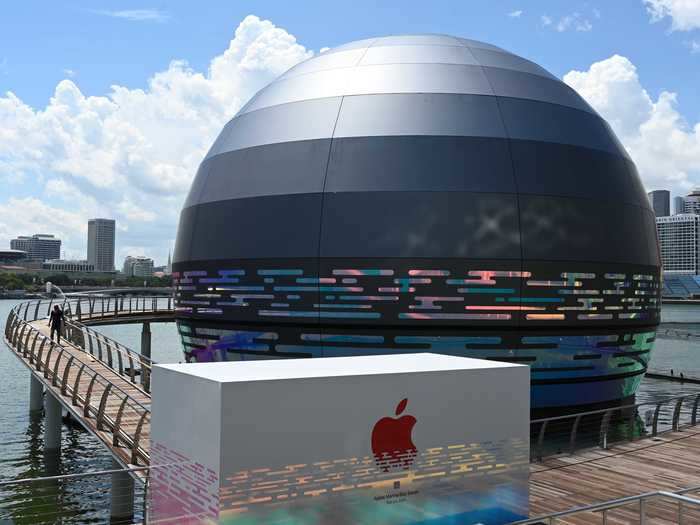 While there will be a red Apple logo on the sphere itself, a white sign bearing the iPhone company